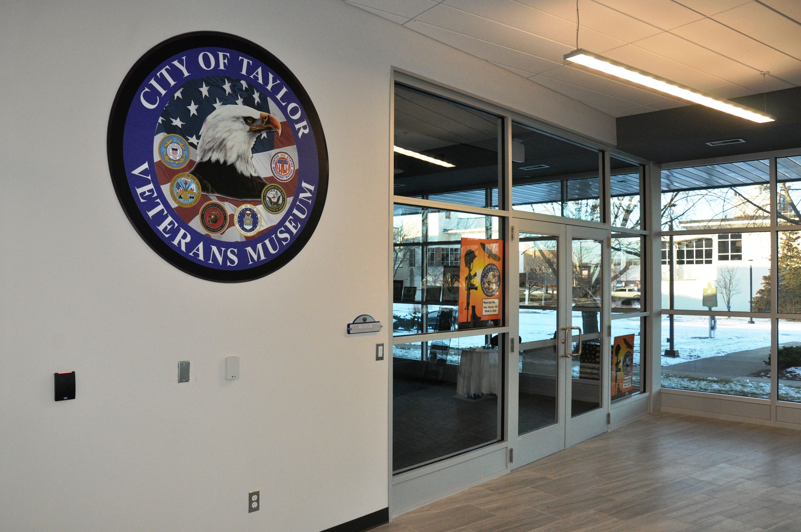 Front doors of the Taylor Veterans Museum adorned with the Museum's seal.