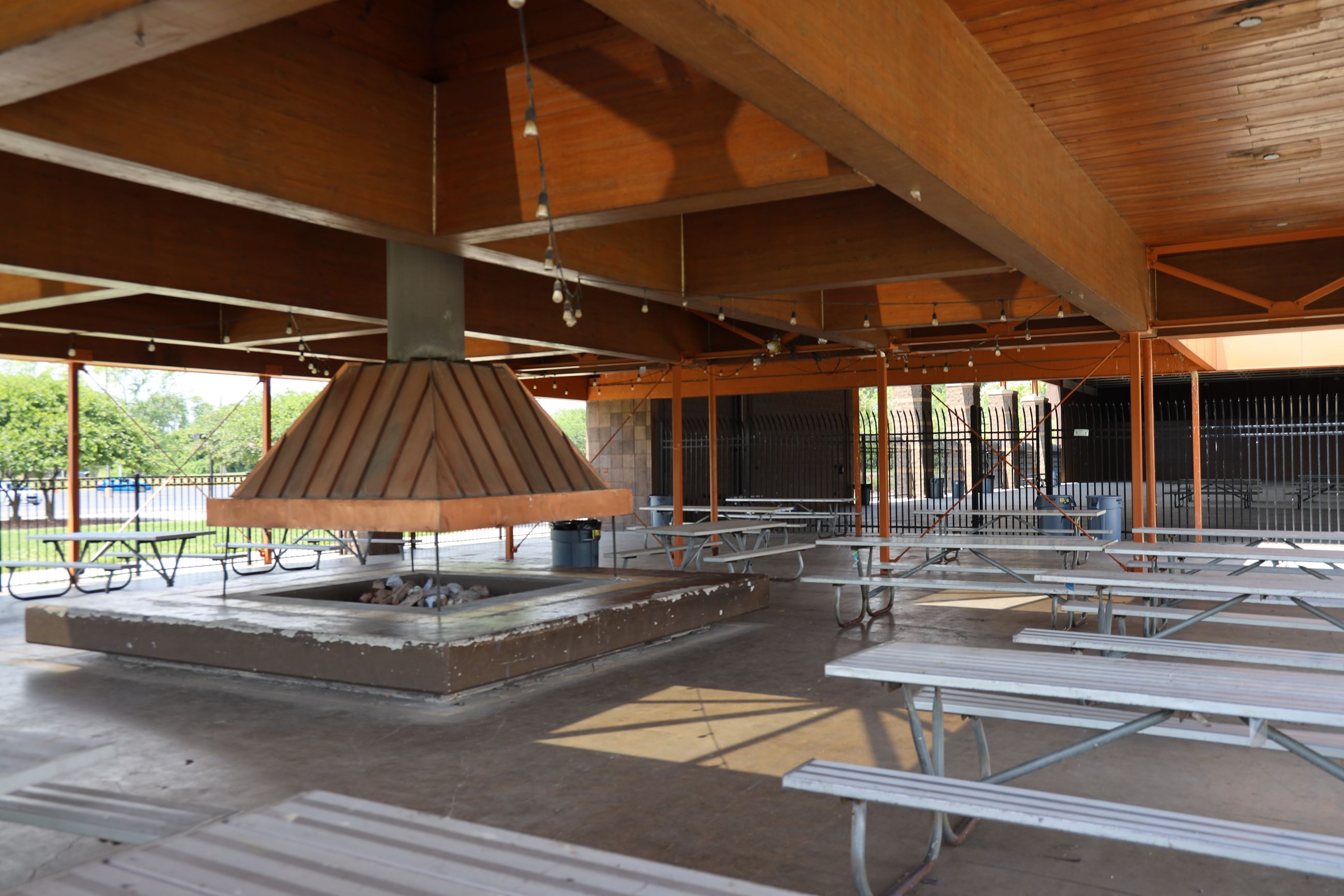 Pavilion area with picnic tables at the Lamarand Splash pad. 