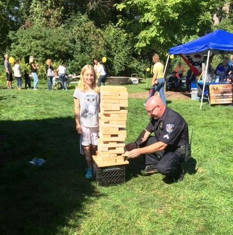 Office and Child Playing Jenga