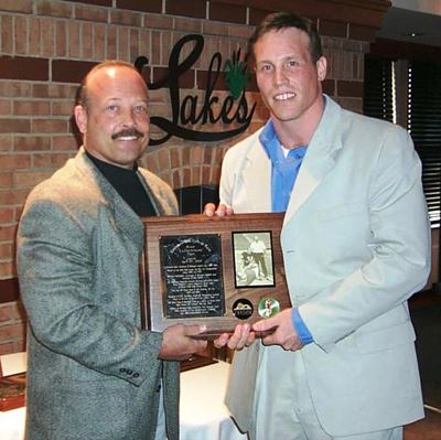 Sean LaFountaine and a man holding a plaque.