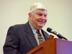 A man, Ken Tippery, speaking at a podium.